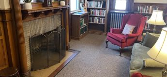 Adams Library's reading room with fireplace