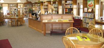 Adams Library childrens' area with desks and tables